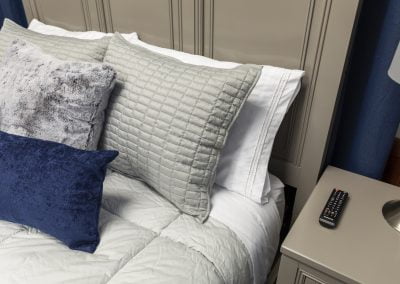 Close up of a bed and nightstand in one of Elite Sleep's sleep testing suites